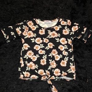 A short sleeve black and pink flower design shirt
